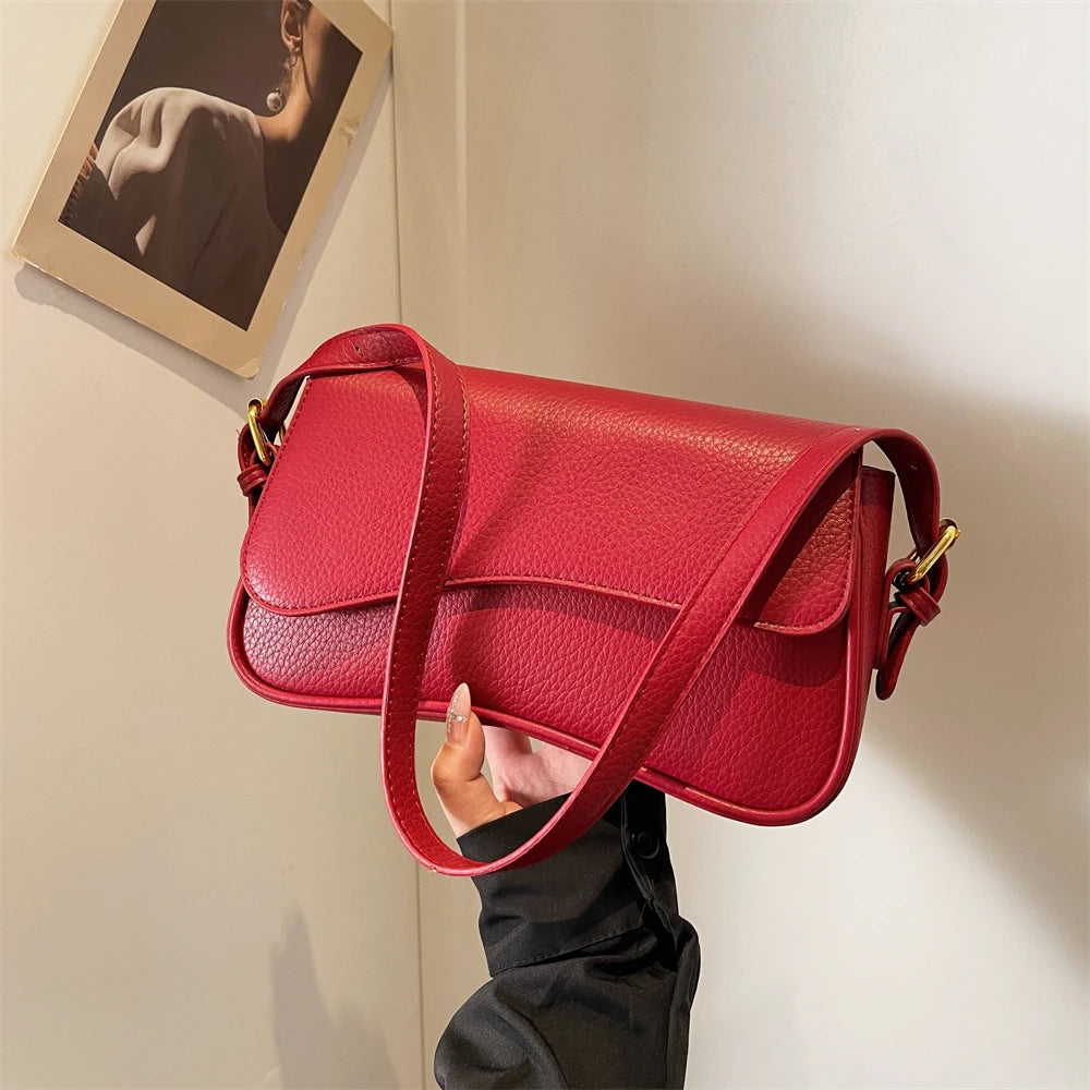 Bolsa transversal MOODS com formas irregulares.